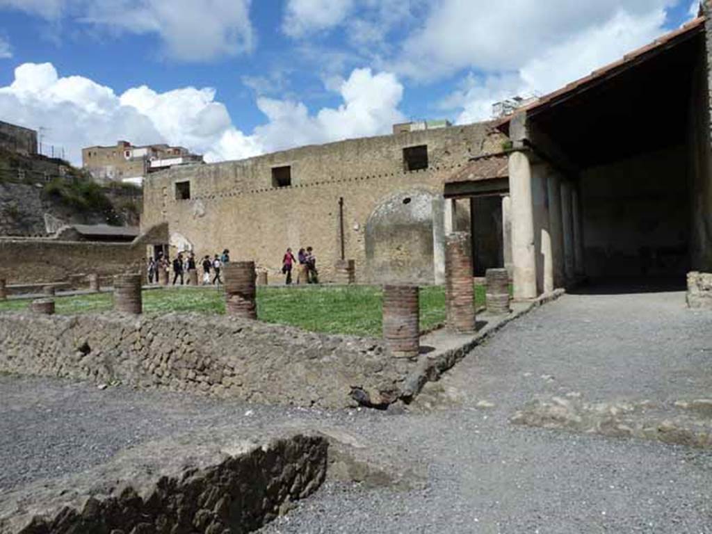 VI.5, Herculaneum. May 2010. Central baths, looking towards palaestra with columned portico.